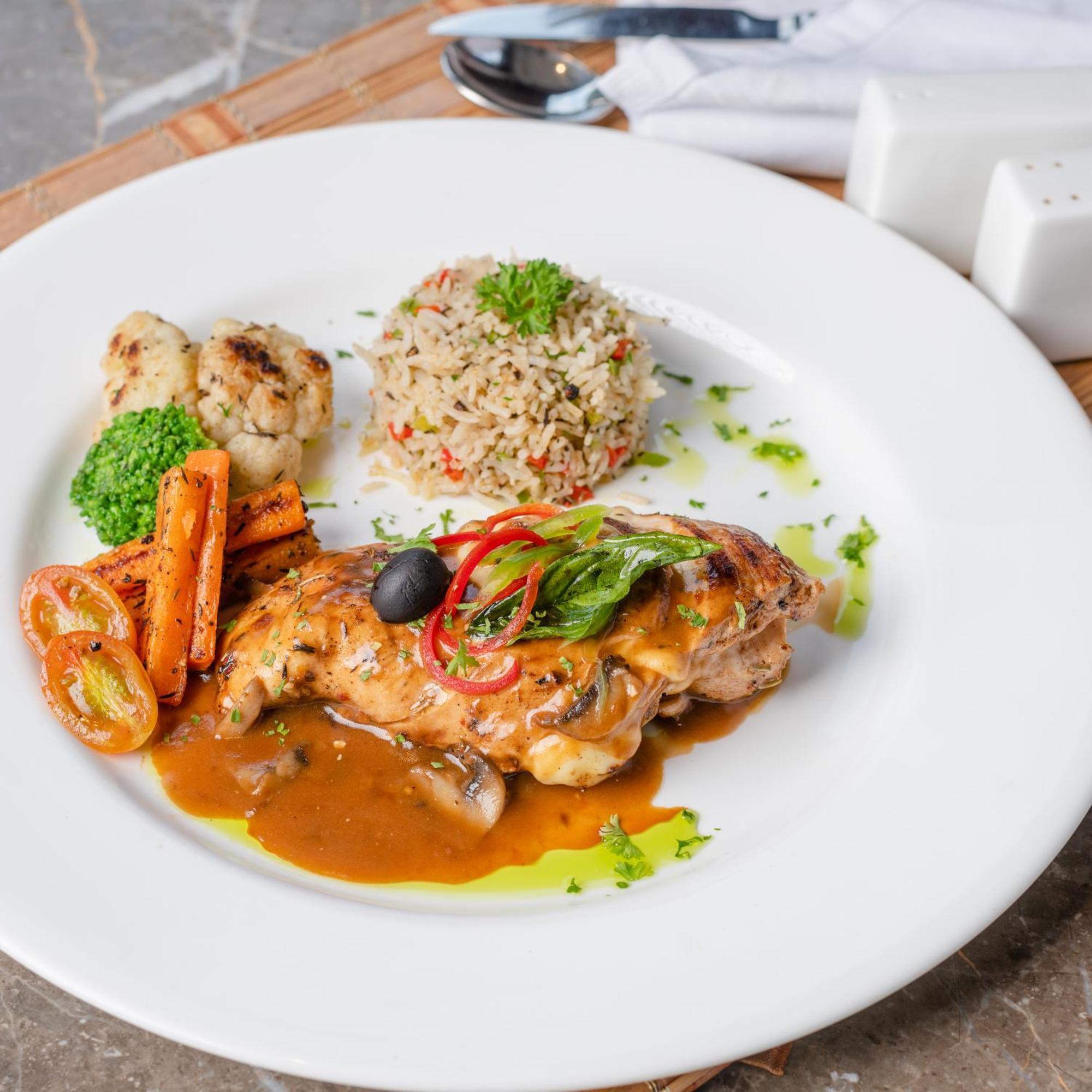 Hotel Southern Star,Mysore Extérieur photo A plate of chicken with bulgur pilaf